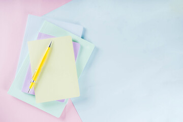 Pastel colored workspace flat lay