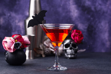 Halloween martini cocktail on purple background