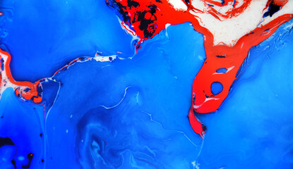 Splash of paint.Closeup abstract color mixing of water, acrylic,oil and milk for use as background image. Acrylic texture with beautiful pattern, multi color background.