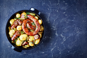 Roasted new potato with pork sausage, copy space