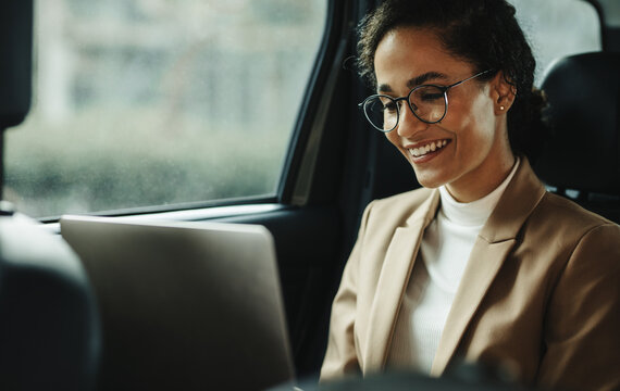 Businesswoman With Laptop Commuting To Work