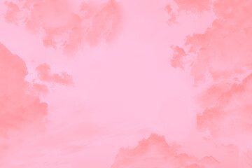 Pink coral clouds in the light pink sky, copy space