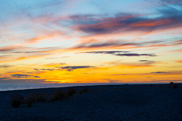 Fototapeta na wymiar Summer sunset over coastal landscape