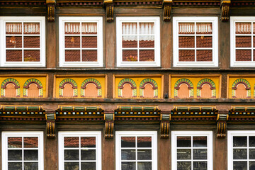 Obraz premium Artfully renovated half-timbered house, facade with carvings and paintings, Germany