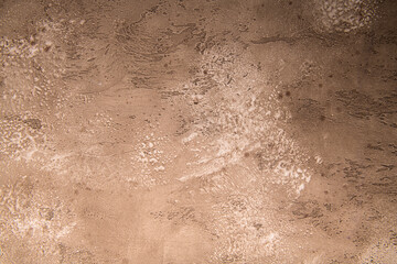 warm brown chocolate background from water-based building plaster