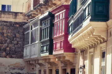 Obraz premium Colourful Balconies, Windows And Doors In A Narrow Street Of malta
