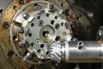 gear cutting machine close up. production of metal parts.