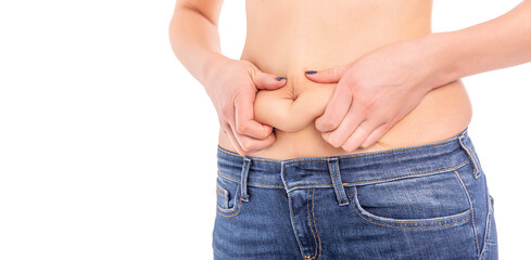 Fototapeta premium Fat woman in jeans on a white background.