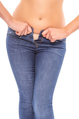Fat woman in jeans on a white background.