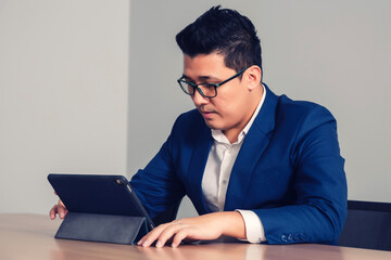 businessman working with tablet in seminar room