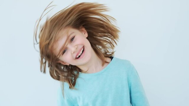 Cute little girl with streaming hair fooling