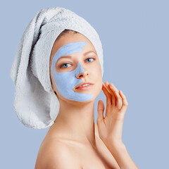 Cosmetology, skin care, face treatment, spa and natural beauty concept. Woman with facial mask.
