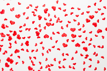 Valentines day background red hearts on wooden background.