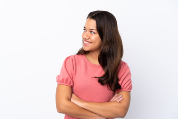 Young Colombian girl over isolated white background happy and smiling