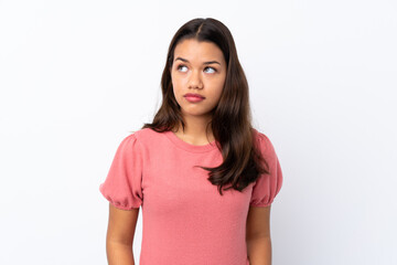 Fototapeta premium Young Colombian girl over isolated white background making doubts gesture looking side