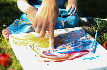 children's hands in paints