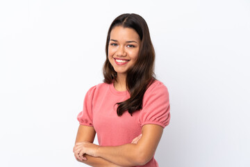 Obraz premium Young Colombian girl over isolated white background with arms crossed and looking forward