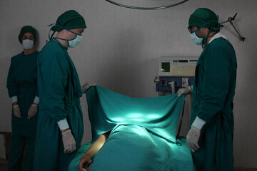 patient die in performing operation in hospital, Team of surgeons so sad and mourning
