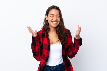 Young Colombian girl over isolated white background laughing