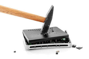 Hammer smashing Internet modem router to pieces. On a white background close-up. A day without...