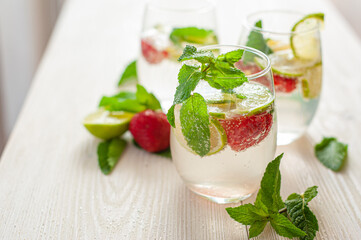 Strawberry mojito on white wooden background