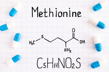 Chemical formula of Methionine with some pills.