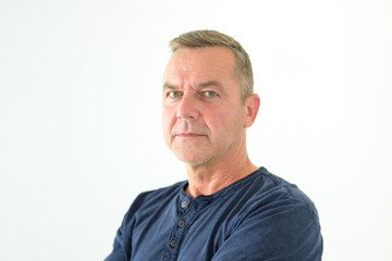 Thoughtful man glancing sideways at camera
