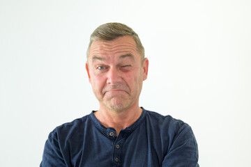 Obraz premium Middle-aged man winking at the camera