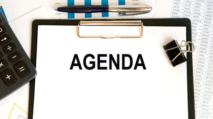 Agenda written on notebook with blank list, planning conceptual