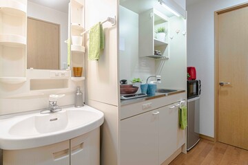 Fototapeta na wymiar Sink and small kitchen corner in the room At the condominium