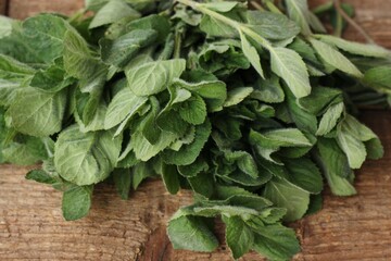 Fresh green mint on a wooden table