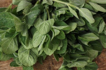 Fresh green mint on a wooden table