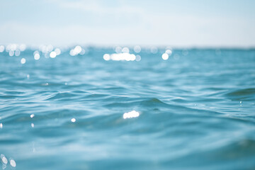 Close up of sea wave, low angle view. Selective focus, bokeh