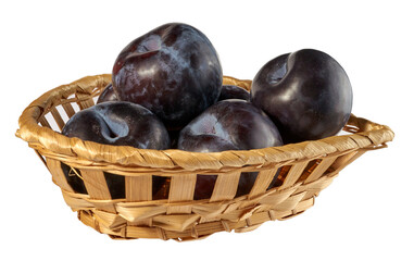 blue plums in a wicker basket isolated on a white background.