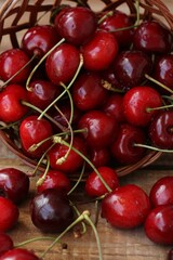 Ripe red cherries on a wooden table