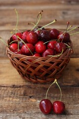 Ripe red cherries on a wooden table