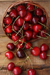 Ripe red cherries on a wooden table