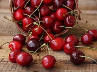 Ripe red cherries on a wooden table