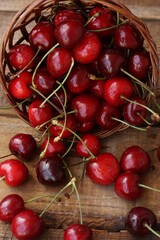 Ripe red cherries on a wooden table