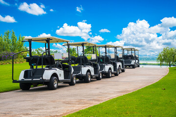 Golf cart on golf course, parking on fairway. Equipment and golf club bag are put in ready for...