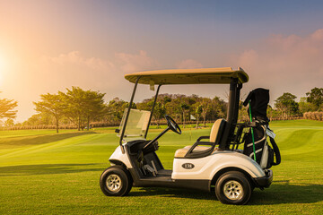 Golf cart on golf course, parking on fairway. Equipment and golf club bag are put in ready for...
