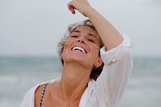 young girl smiling with white teeth outdoors, lifestyle concept