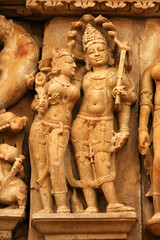 Close up of artful carved walls, Ancient reliefs at famous erotic temple in Khajuraho, Madhya Pradesh, India.