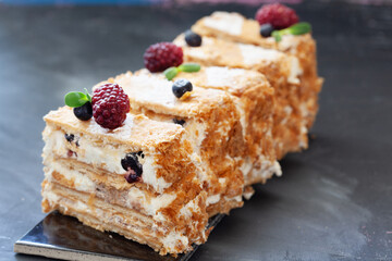 Puff pastry napoleon cake with vanilla cream and berries