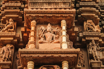 Close up of artful carved walls, Ancient reliefs at famous erotic temple in Khajuraho, Madhya...