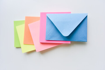 selective focus, blue envelope in the center with colored rectangles spreading under it