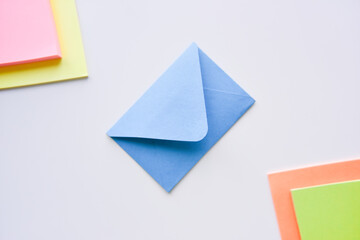 selective focus, blue envelope in the center with colored rectangles in corners