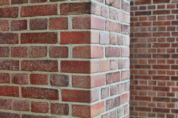 Brick and brick edge of pillar against wall