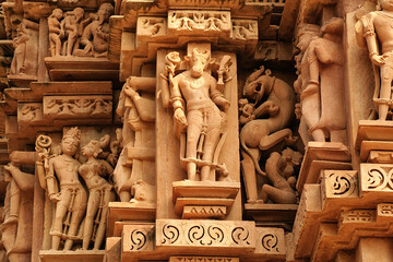 Close up of artful carved walls, Ancient reliefs at famous erotic temple in Khajuraho, Madhya Pradesh, India.