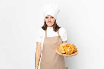 Young woman in chef uniform isolated on white background having doubts and with confuse face expression